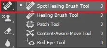 Select Spot Healing Brush Tool